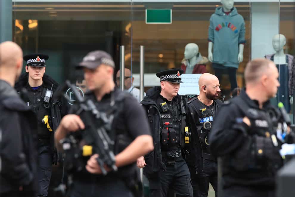 Armed police officers outside the Arndale Centre (Peter Byrne/PA)