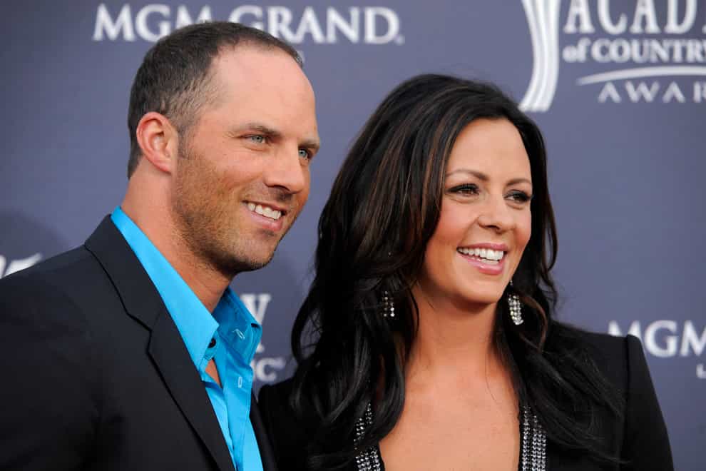 Former Alabama quarterback Jay Barker and his wife, country music singer Sara Evans, arrive at the 46th annual Academy of Country Music Awards in Las Vegas in 2011 (Chris Pizzello/AP)