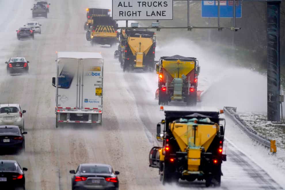 Vehicles navigate hazardous driving conditions in North Carolina (Gerry Broome/AP)