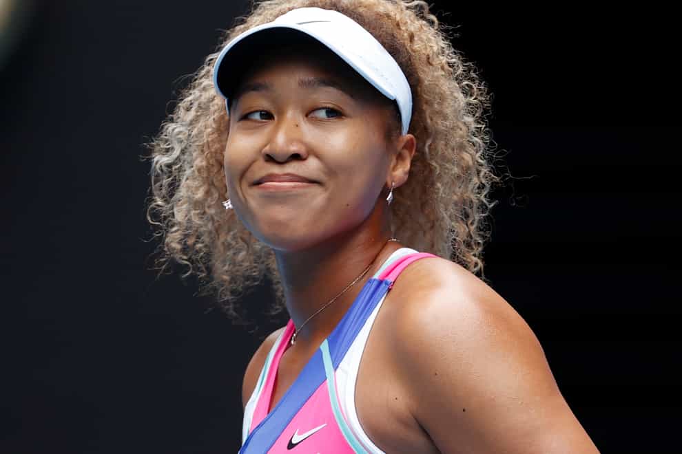 Naomi Osaka smiles on her return to the Australian Open (Simon Baker/AP)