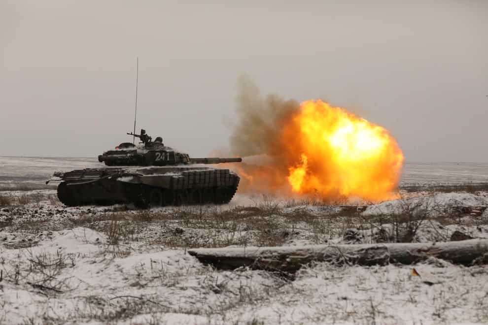 A Russian tank fires as troops take part in drills at the Kadamovskiy firing range in the Rostov region in southern Russia (AP)
