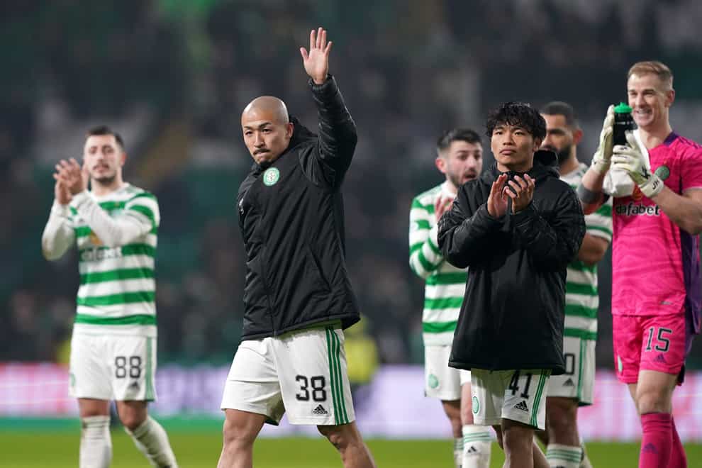 Celtic’s Daizen Maeda (left) and Reo Hatate wave and applaud the fans (Andrew Milligan/PA)