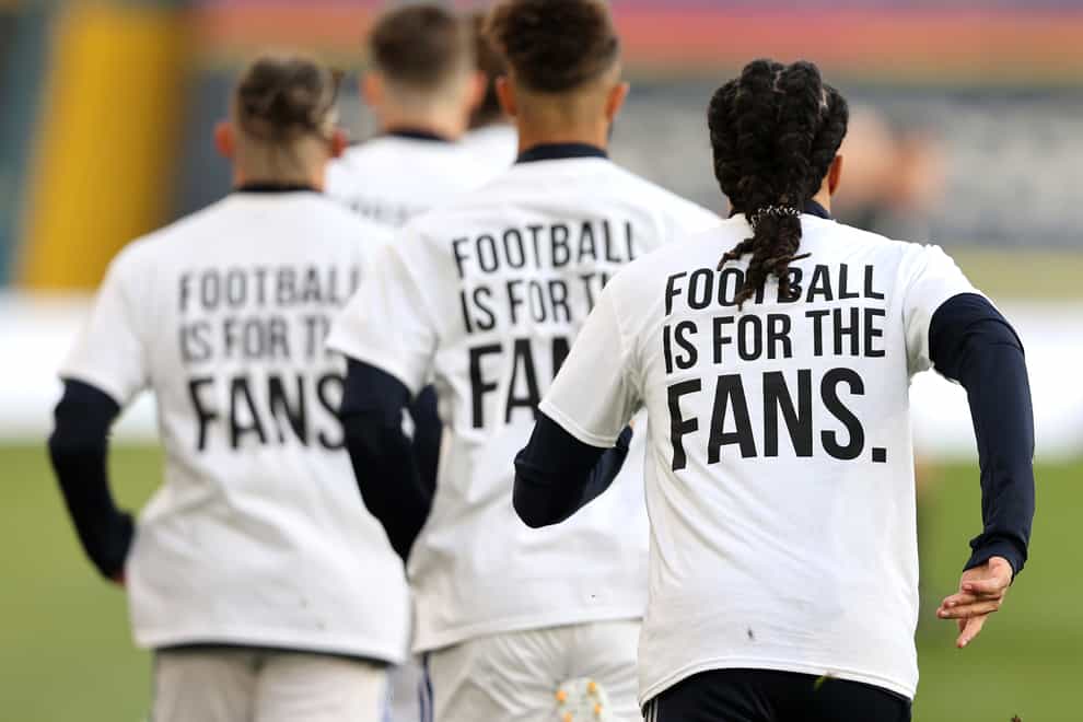 ‘Football Is For The Fans’ t-shirts are worn by Leeds players during the warm-up of last season’s game with Liverpool (Clive Brunskill/PA)