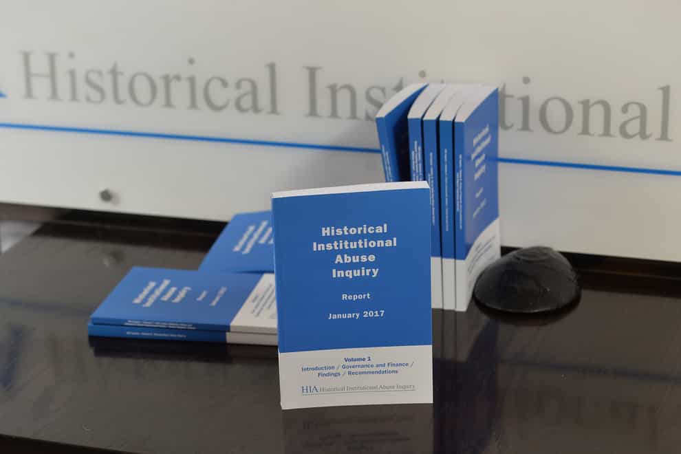 Copies of the Historical Institutional Abuse inquiry report on show during the press conference in Belfast on its publication.