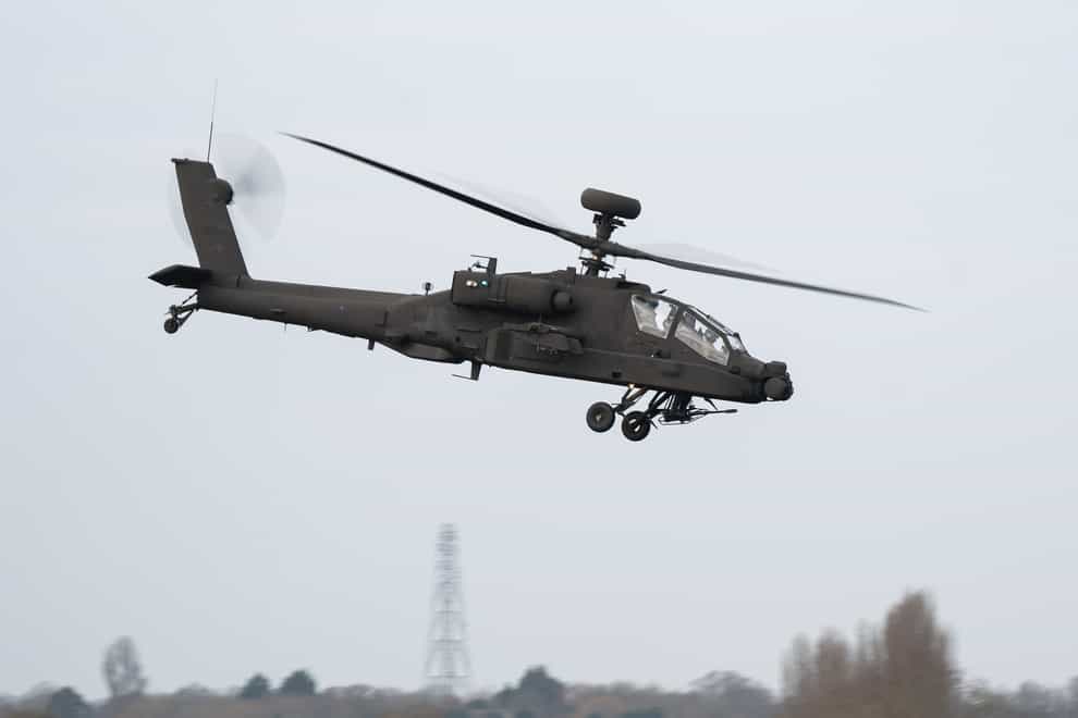 The Army’s new Apache AH-64E attack helicopter is displayed at Wattisham Flying Station, Suffolk. (Joe Giddens/PA)