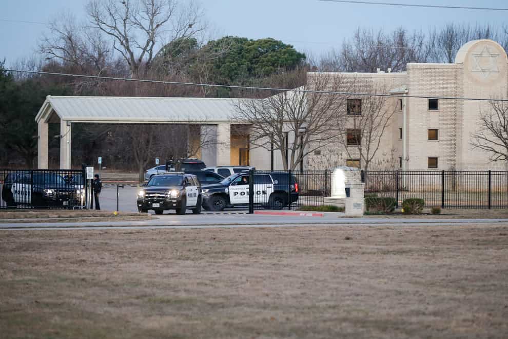 Police in front of the Congregation Beth Israel synagogue during the hostage incident (Brandon Wade/AP/PA)