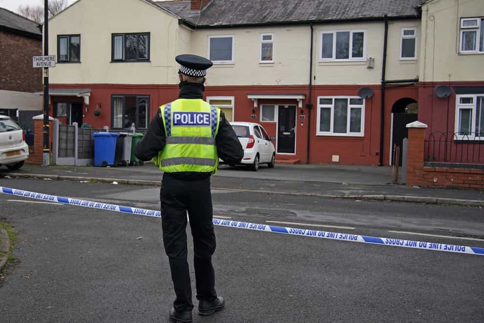 Police at the scene after a 16-year-old boy was fatally stabbed on on Thirlmere Avenue in Stretford, Manchester (Peter Byrne/PA)