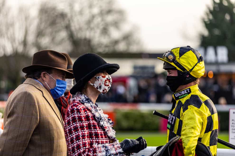 Jockey Nico de Boinville (right) speaks to trainer Nicky Henderson (left) after winning the Ladbrokes Desert Orchid Chase on Shishkin during Desert Orchid Chase Day of the Ladbrokes Christmas Festival at Kempton Park. Picture date: Monday December 27, 2021.