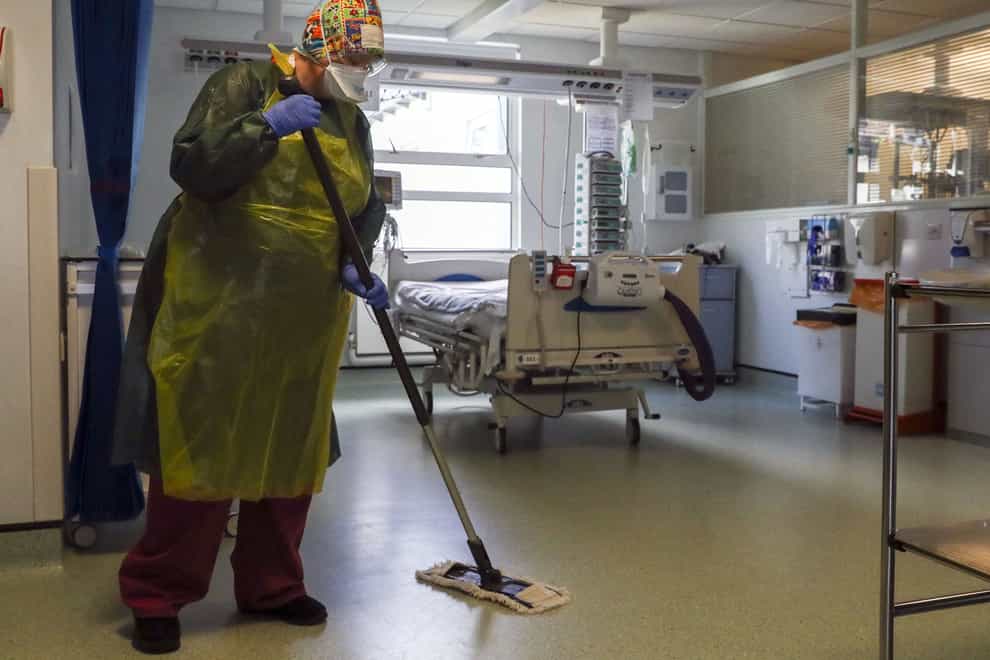 File photo dated 27/5/2020 of a cleaner working on a hospital ward. Hundreds of hospital workers including porters, cleaners and catering staff, are to go on strike in a dispute over pay (Steve Parsons/PA)