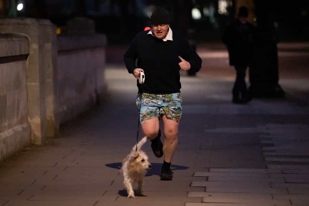 Prime Minister Boris Johnson jogging in central London (Aaron Chown/PA)