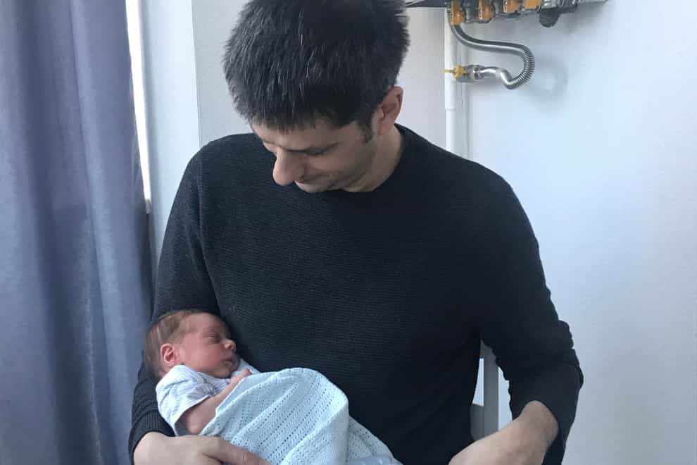 Ben Garratt and his wife are living in Ukraine to oversee paperwork after the surrogate birth of their baby, Raphael (Ben Garratt/PA)