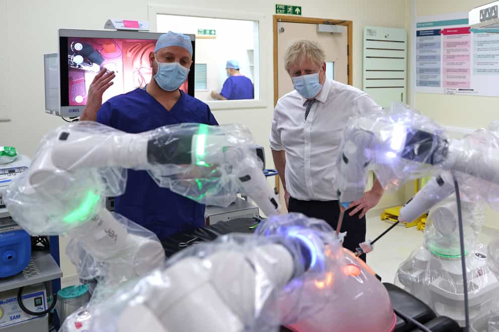 Prime Minister Boris Johnson has defended the rise in national insurance during a visit to Milton Keynes Hospital (Adrian Dennis/PA)