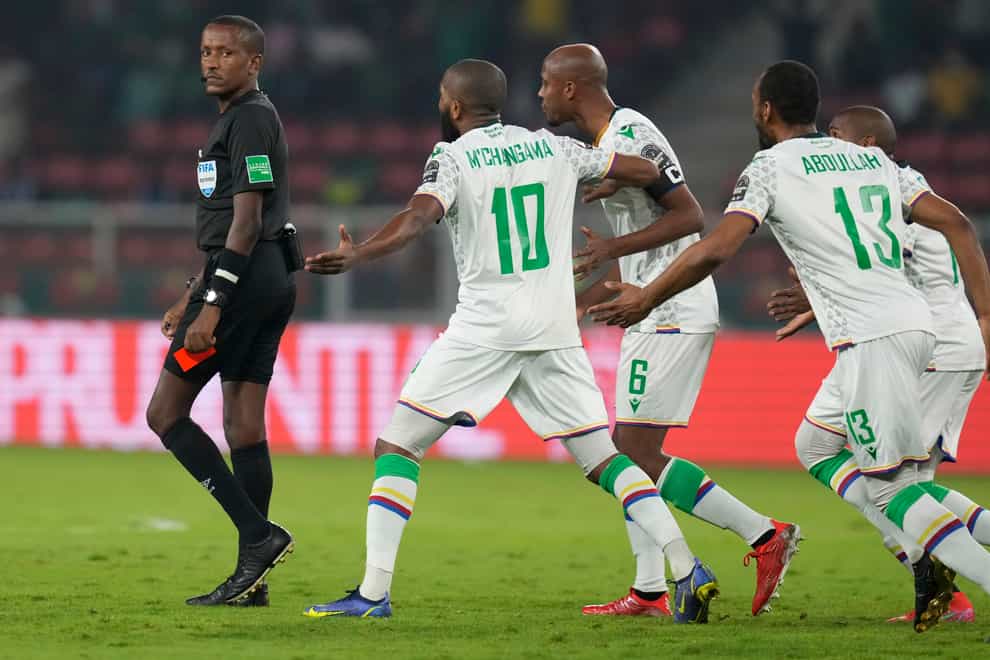 Referee Bamlak Tessema (left) prepares to show a red card to Comoros captain Jimmy Abdou (centre) at the Africa Cup of Nations round of 16 tie (Themba Hadebe/AP)