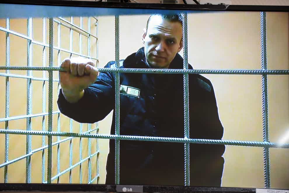 Russian opposition leader Alexei Navalny looks at a camera while speaking from a prison via a video link, provided by the Russian Federal Penitentiary Service, during a court session in Petushki, Vladimir region, about 120 kilometers (75 miles) east of Moscow, Russia, Monday, Jan. 17, 2022. Jailed Russian opposition leader Alexey Navalny appears in the Petushinsky court via video link at a hearing on his lawsuit against his prison colony classifying him as posing a potential extremist or terrorist threat. (AP Photo/Denis Kaminev)