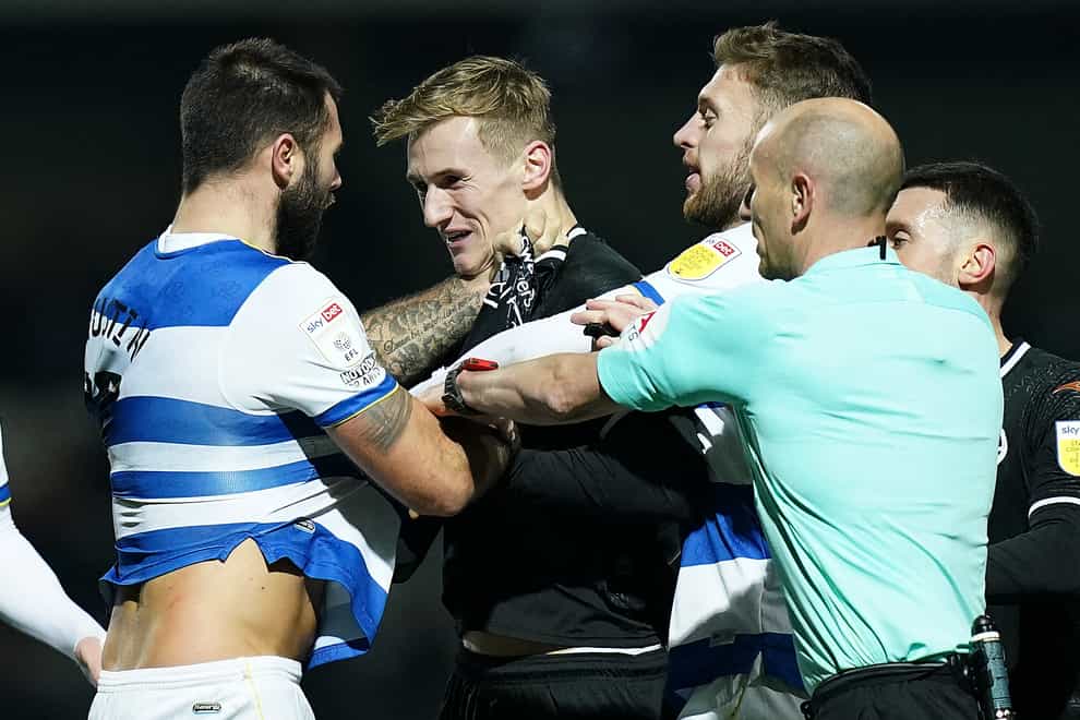 QPR’s Charlie Austin and Swansea’s Flynn Downes tussle during Tuesday’s match (Adam Davy/PA).