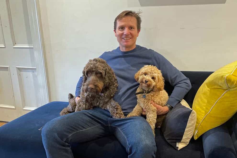 Roger Black at home with his dogs (Roger Black/PA)