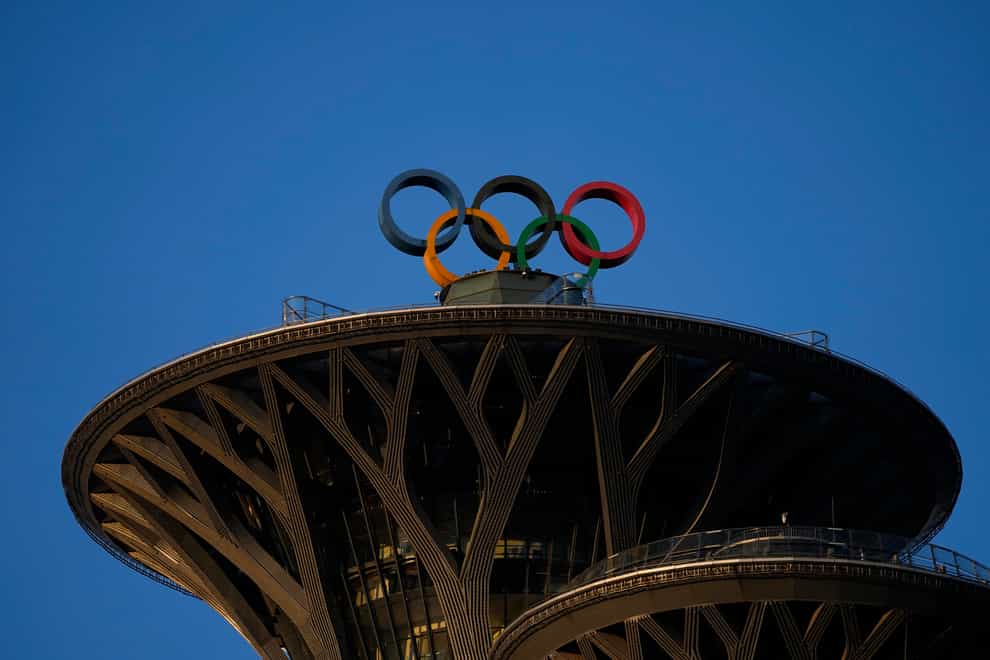The Olympic rings sit on the top of the Beijing Olympic Tower at the 2022 Winter Olympics (Jae C Hong/AP)