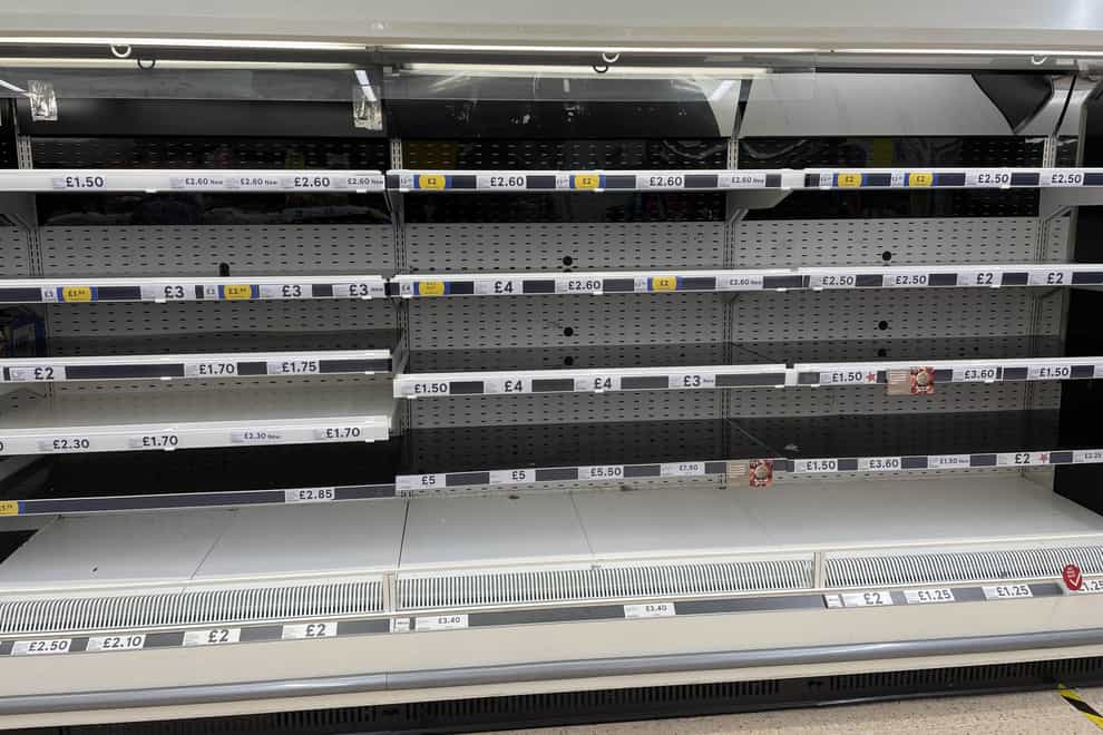Empty shelves in the meat aisle of a branch of Tesco in Liverpool in September (PA)