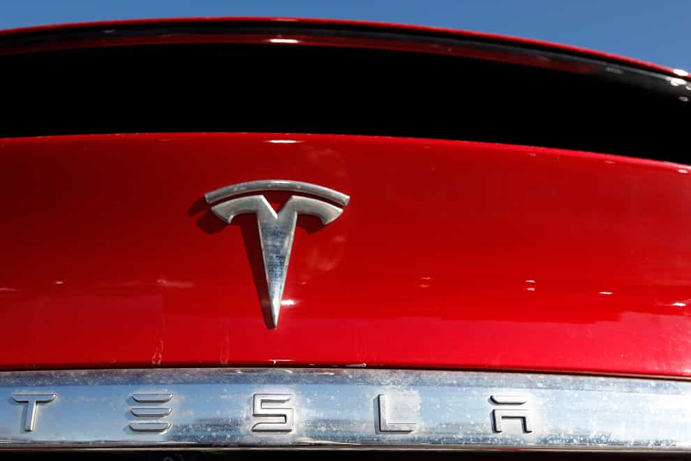 Tesla has reported record earnings (David Zalubowski/AP)