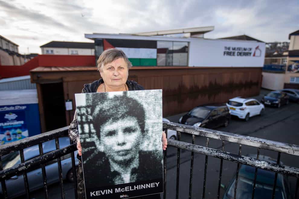 Kevin McElhinney’s sister Jean Hegarty holds an image of her brother outside the Bogside Museum in Londonderry (Liam McBurney/PA)