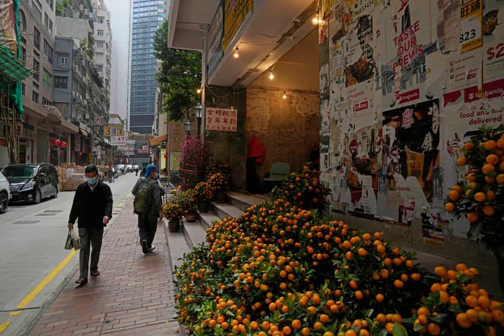 Pots of citrus trees are displayed for sale on a street to celebrate the Lunar New Year in Hong Kong (AP)