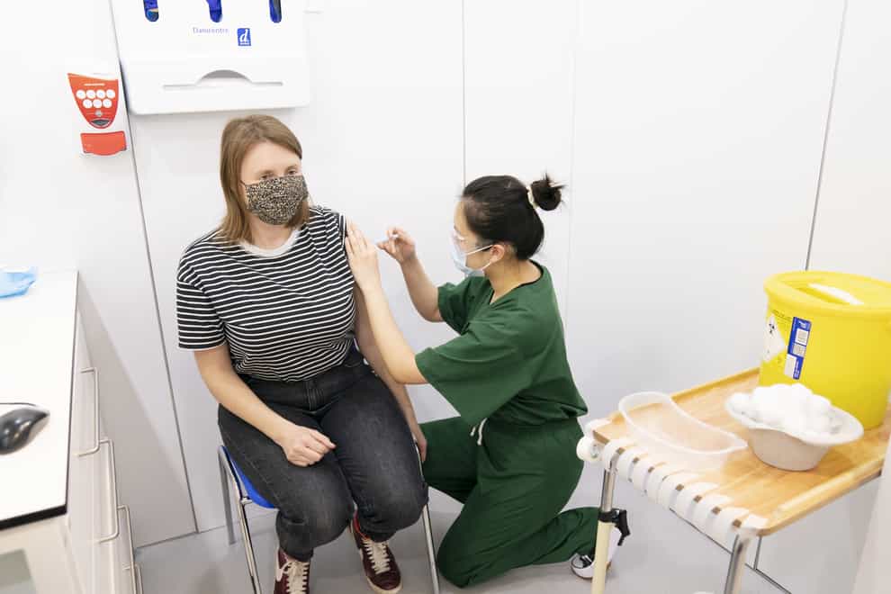 Roofers, beauticians and bar staff are among the occupations where people work close to each other but which are likely to have the highest levels of non-vaccination against Covid-19, new figures suggest (PA)