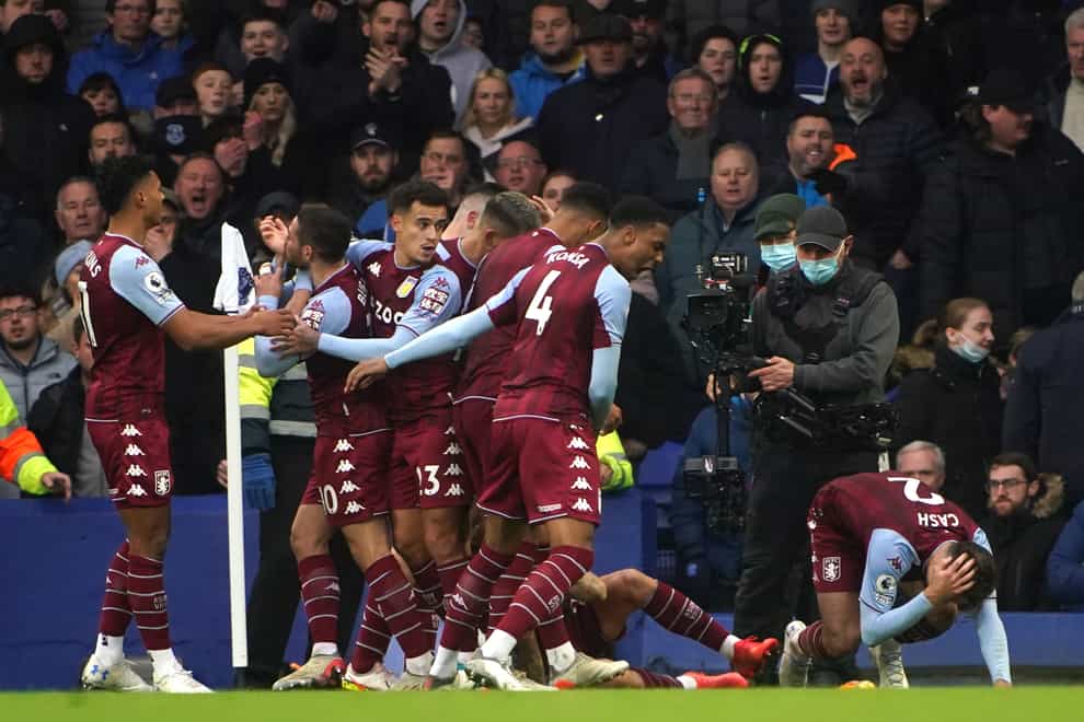 Aston Villa’s Lucas Digne and Matty Cash react to being hit by a missile at Everton (Peter Byrne/PA)
