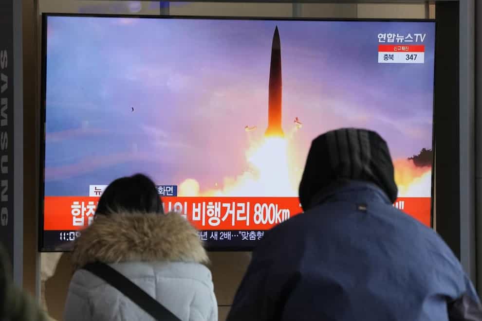 People watch a TV showing a file image of North Korea’s missile launch during a news program at the Seoul Railway Station in Seoul, South Korea on Sunday. (AP Photo/Ahn Young-joon)