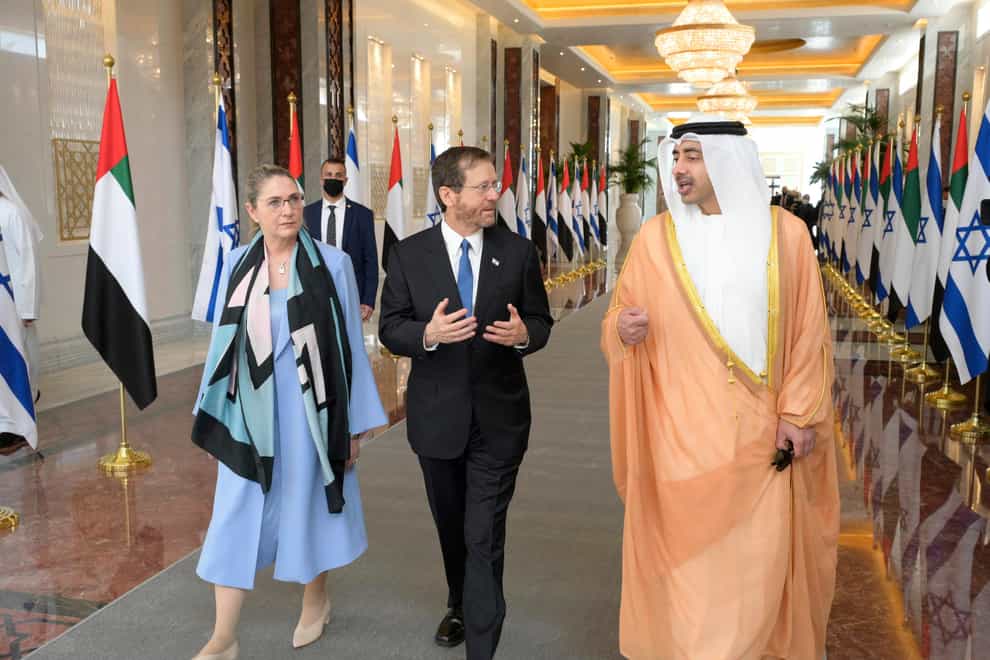Israeli President Isaac Herzog and First Lady Michal Herzog are welcomed to Abu Dhabi by UAE Foreign Minister Sheikh Abdullah bin Zayed Al Nahyan (Amos Ben Gershom/GPO/AP)