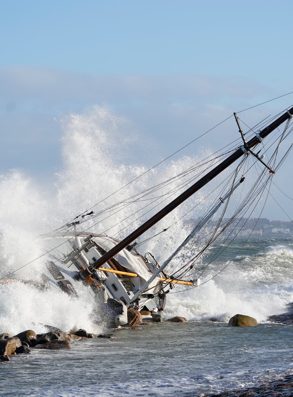 Waves crash against a boat in Elsinore, Denmark (Keld Navntoft/Ritzau Scanpix via AP)