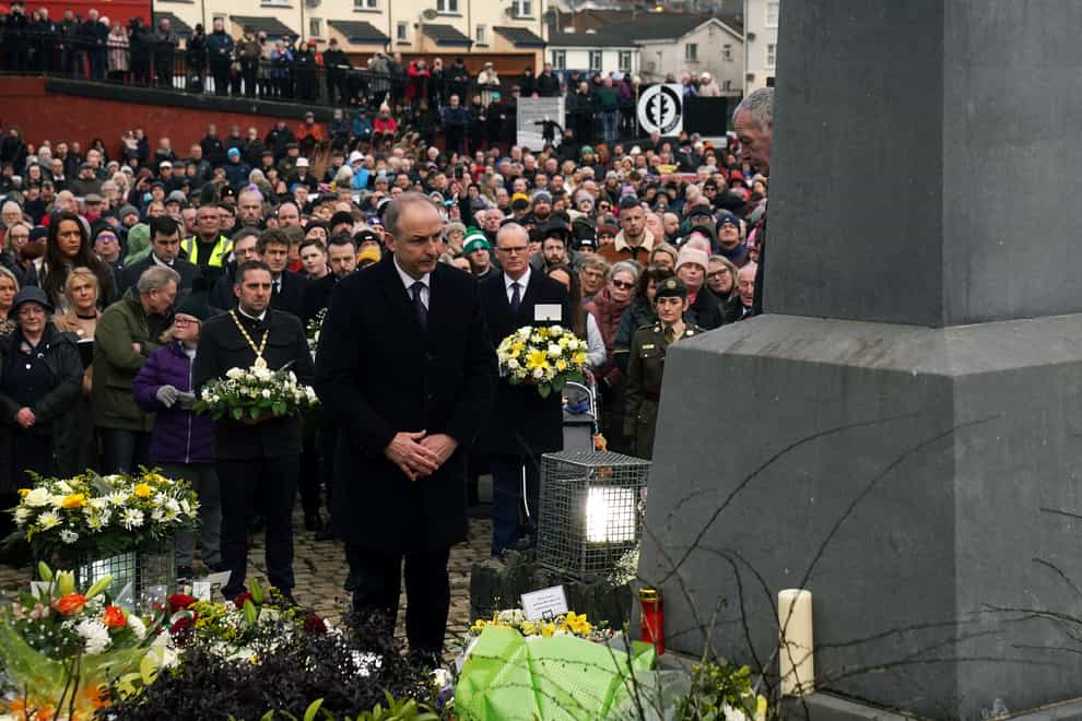 Taoiseach Micheal Martin lays a wreath during a ceremony at the Bloody Sunday Memorial (Brian Lawless/PA)