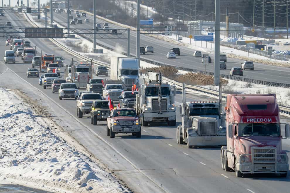 A trucker convoy driving to Parliament Hill in Ottawa (Frank Gunn/The Canadian Press via AP)