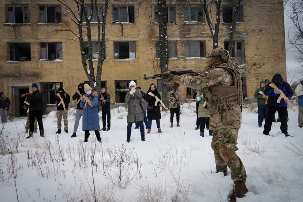 Local residents train close to Kyiv, Ukraine (AP)