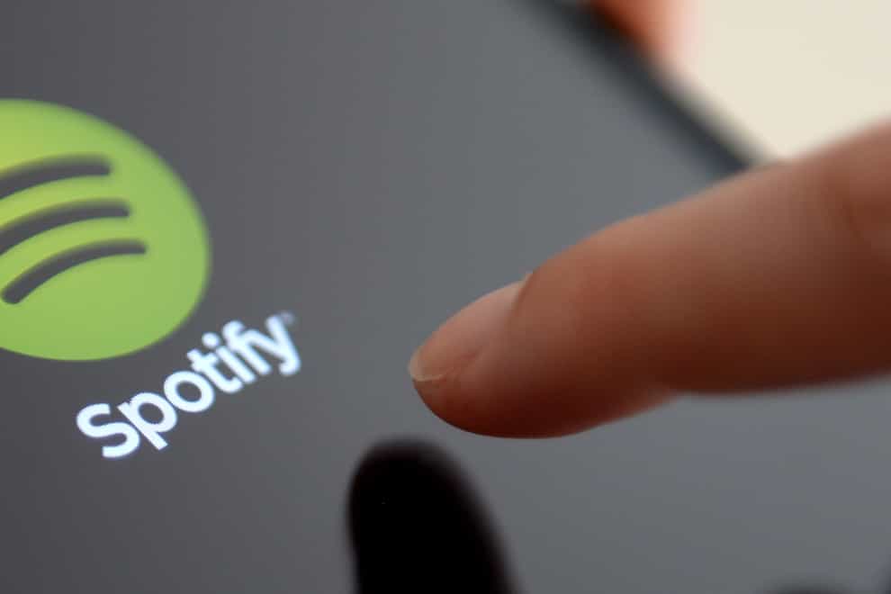 The Spotify App is shown in an Apple iPad mini