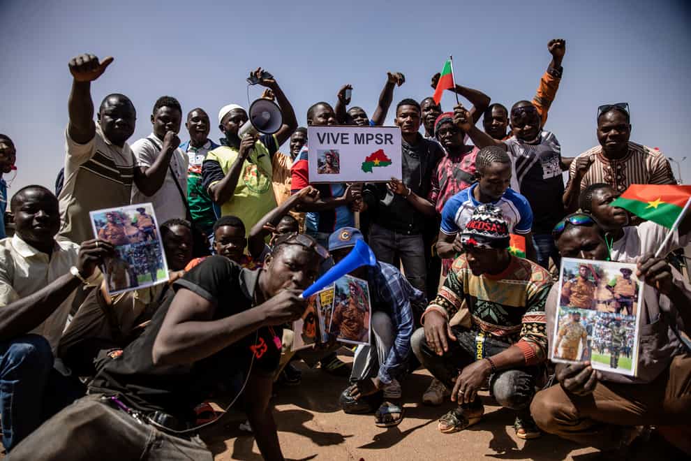 People take to the streets of Ouagadougou, Burkina Faso, to rally in support of the new military junta that ousted democratically elected President Roch Marc Christian Kabore and seized control of the country (Sophie Garcia/AP)