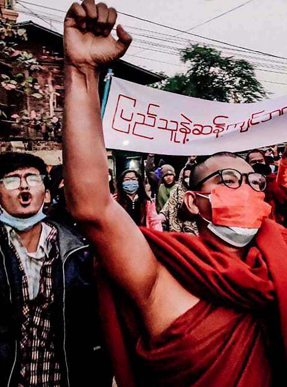 A Buddhist monk raises his clenched fist during an anti-military government protest rally (AP)