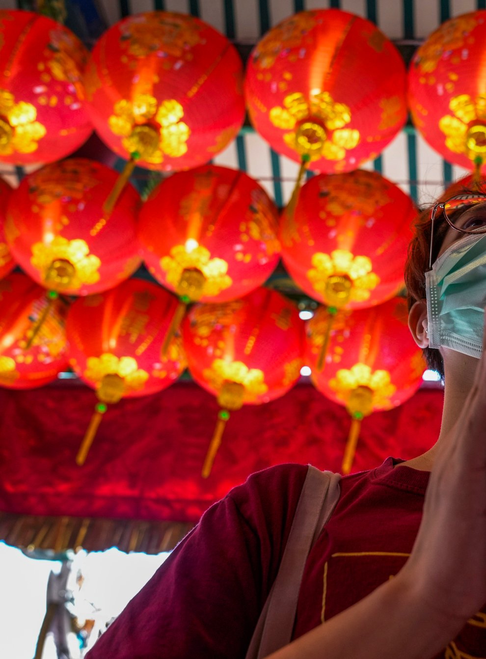 A person in Thailand prays for good fortune on the eve of the Lunar New Year (Sakchai Lalit/AP)