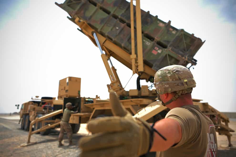 Scottlin Bartlett of the 5-52 Air Defense Artillery Battalion signals to a colleague while working near a Patriot missile battery at Al-Dhafra Air Base in Abu Dhabi, United Arab Emirates (Staff Sgt. Jao’Torey Johnson/U.S. Air Force via AP/PA)