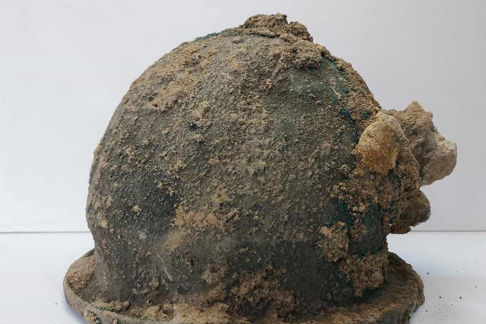 An ancient warrior helmet found in the Archaeological Park of Paestum and Velia, near Naples, Italy (Archaeological Park of Paestum and Velia via AP)