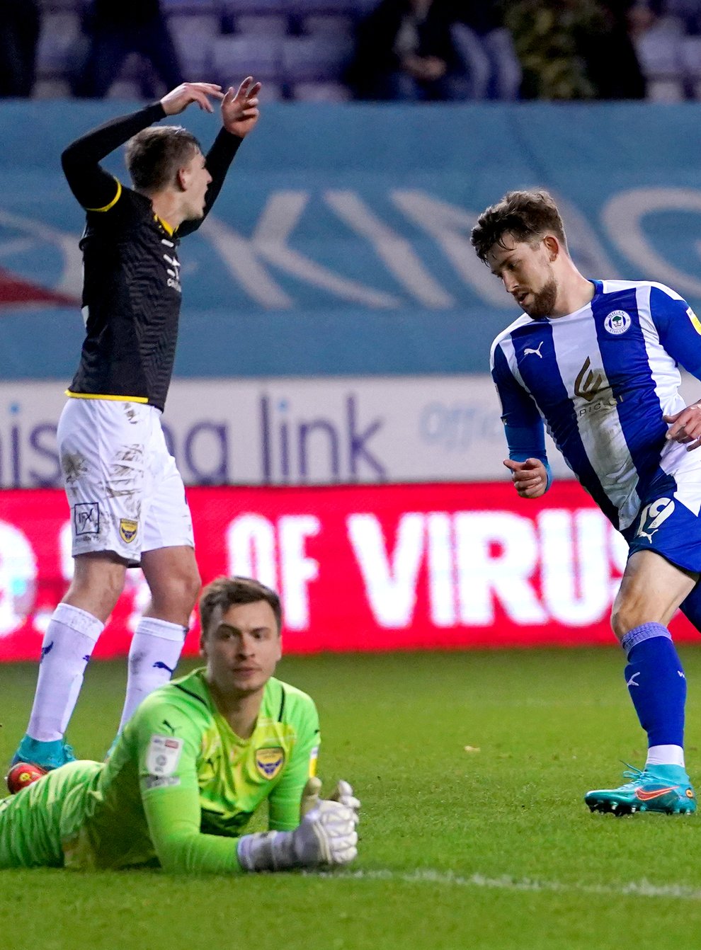 Callum Lang (right) equalised for the high-flying Latics (Martin Rickett/PA)