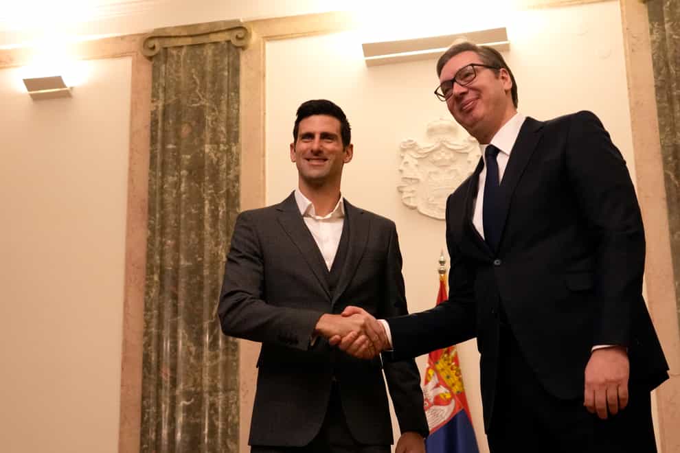 Novak Djokovic shakes hands with Serbia’s President Aleksandar Vucic (Darko Vojinovic/AP)