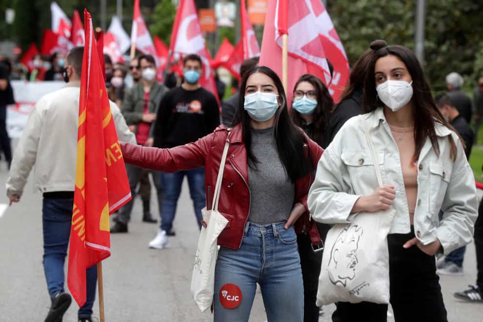 People take part in the traditional May Day workers rally in Madrid (AP)