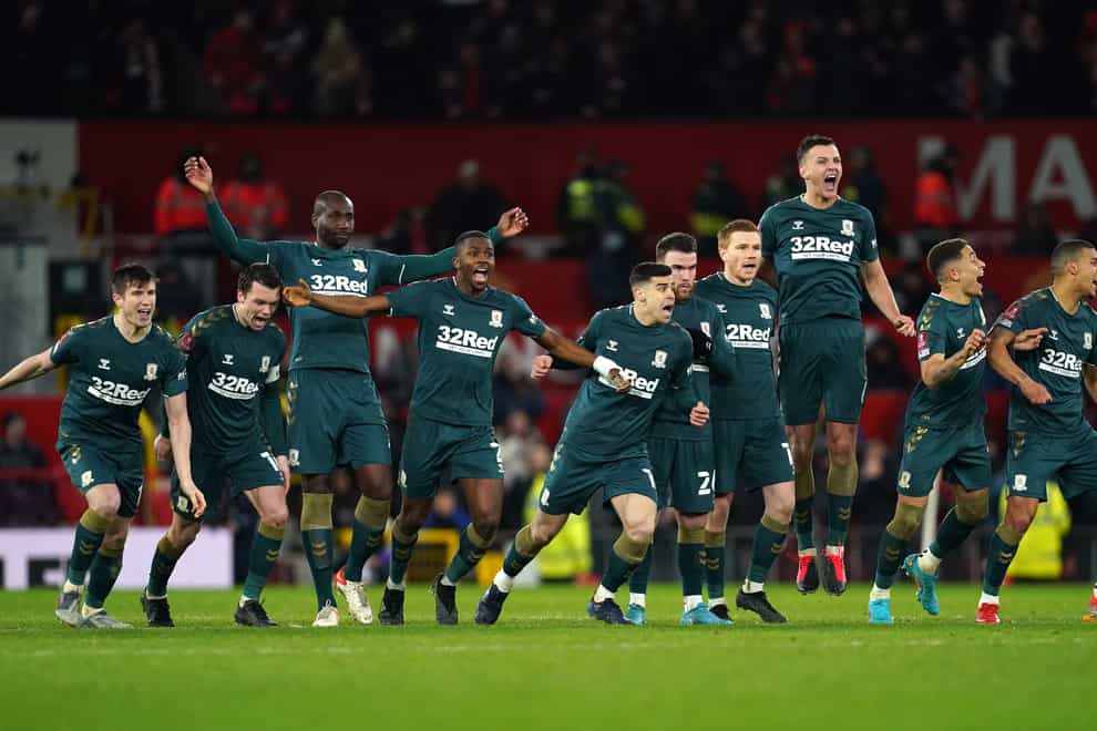 Middlesbrough players celebrate winning the penalty shoot-out after the Emirates FA Cup fourth round match at Old Trafford (PA)