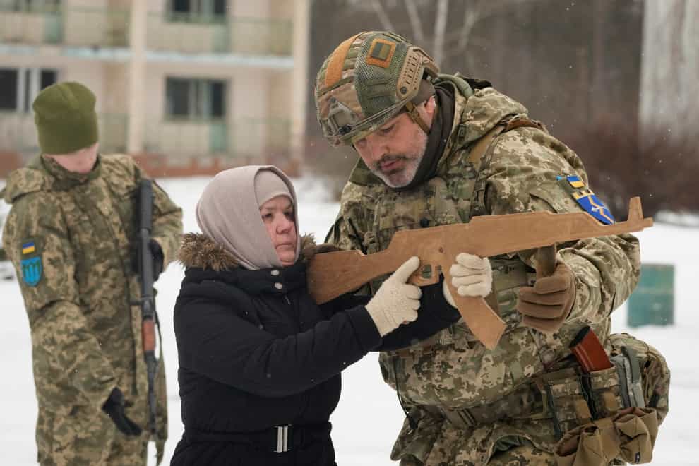 An instructor trains Rumia, 59, a member of Ukraine’s Territorial DefenCe Forces, close to Kyiv (Efrem Lukatsky/ap)