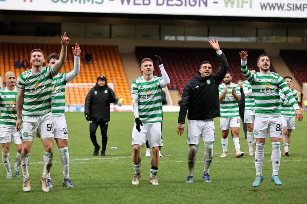 League leaders Celtic celebrate at Fir Park (Steve Welsh/PA)