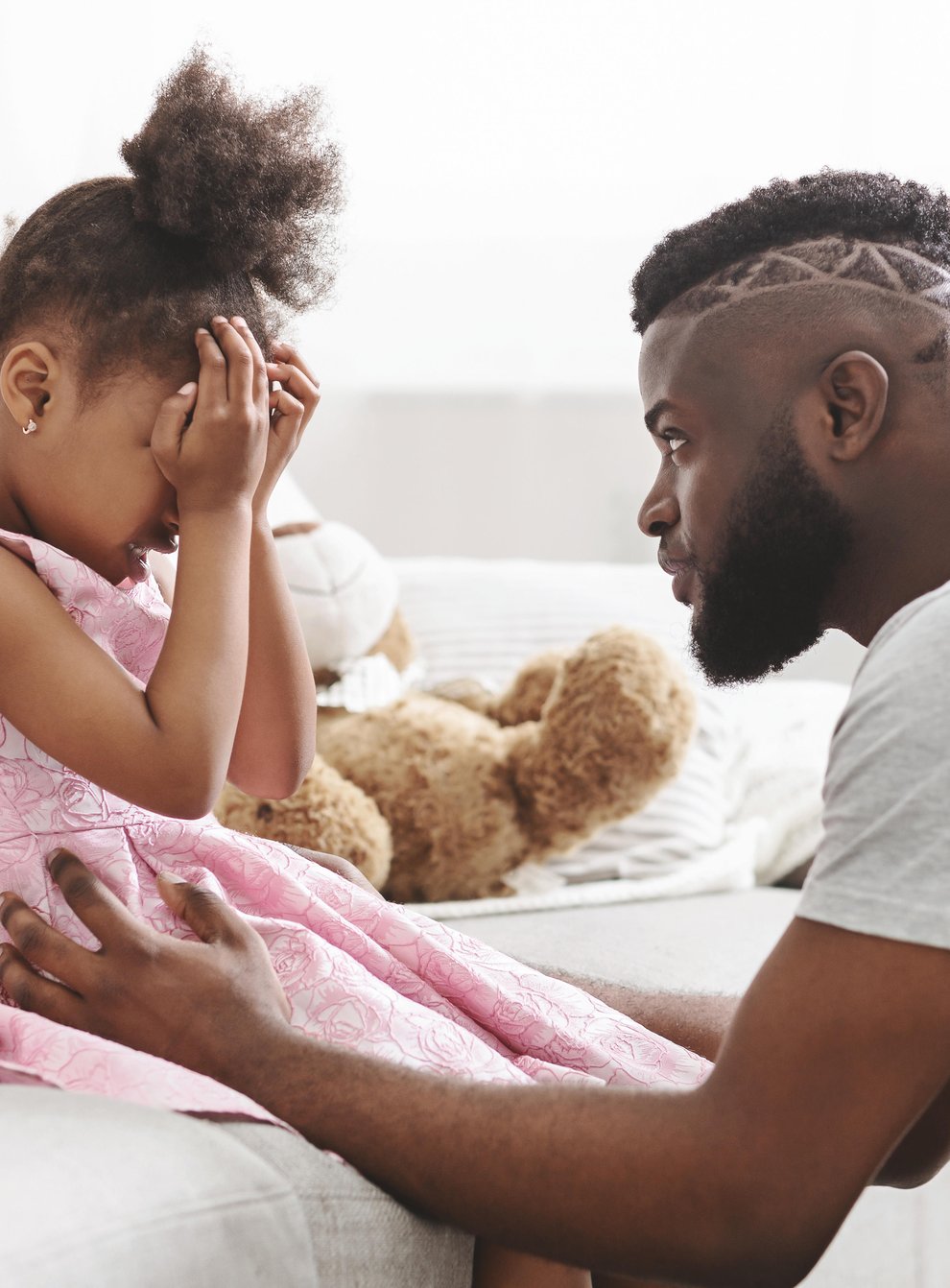 TC2CF4 Loving african american dad comforting crying daughter
