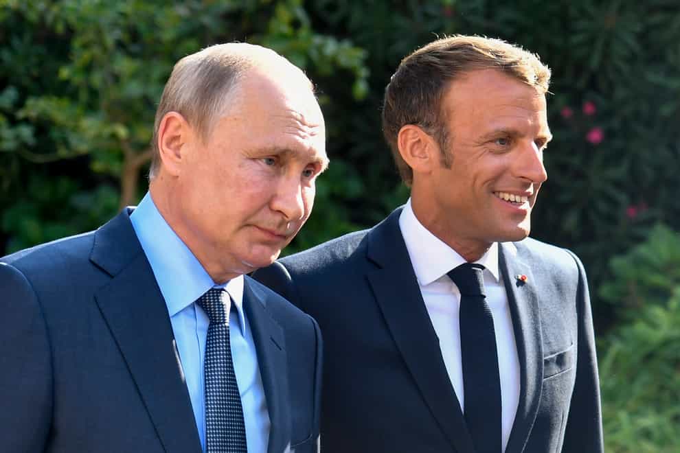 Vladimir Putin and Emmanuel Macron, pictured in 2019 (AP)