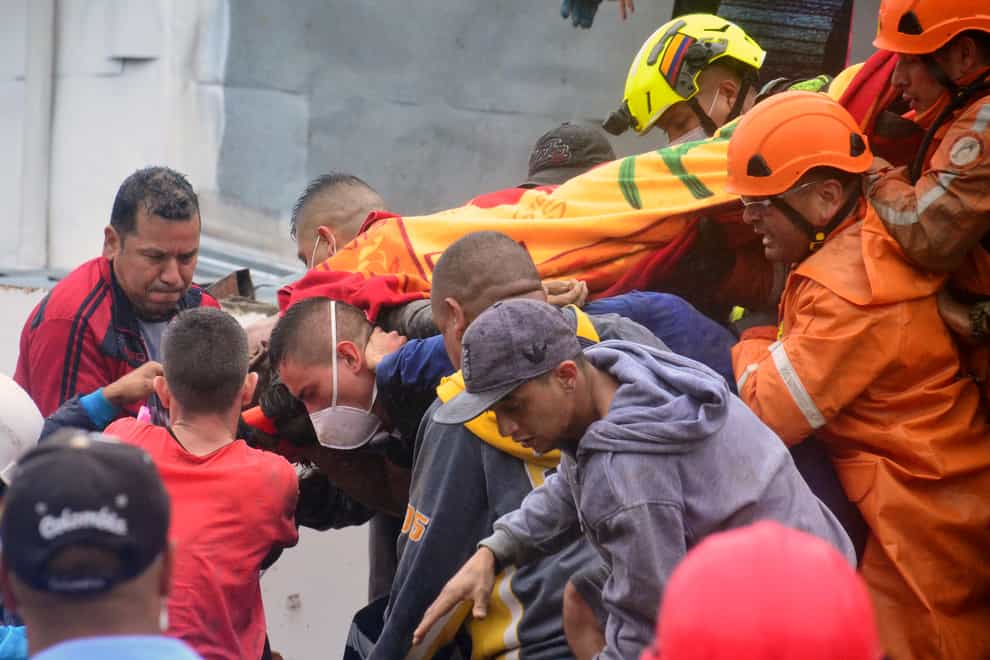 Rescue workers (Andres Otalvaro/AP)