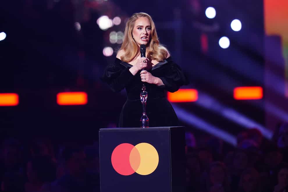 Adele receives the award for Artist of the Year (Ian West/PA)