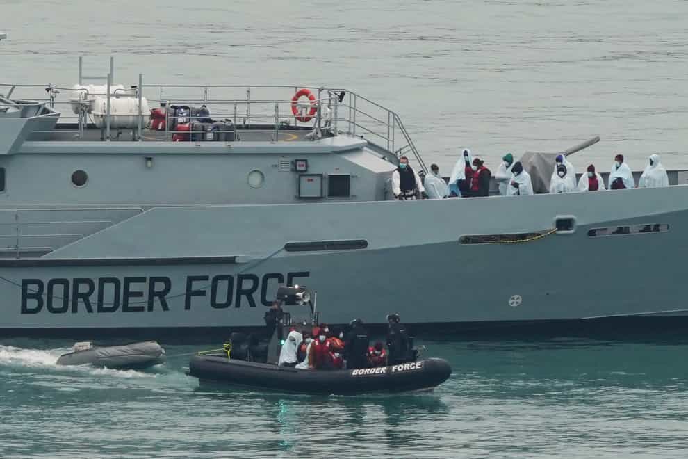 File photo dated 16/12/21 of a group of people thought to be migrants are brought in to Dover, Kent, by Border Force officers (Gareth Fuller/PA)